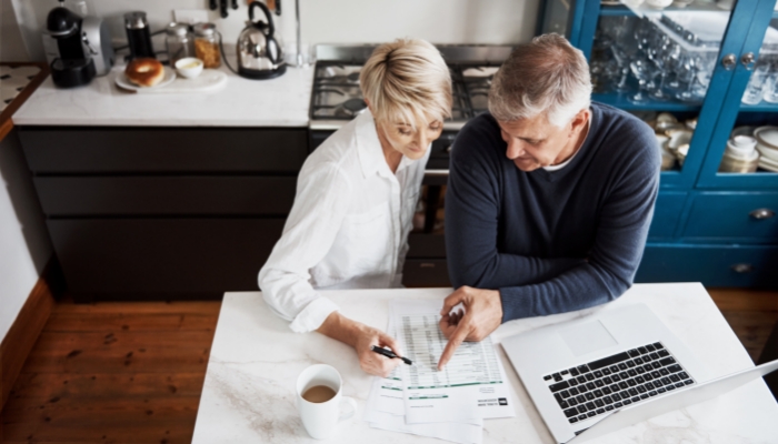 couple at table looking at paperwork